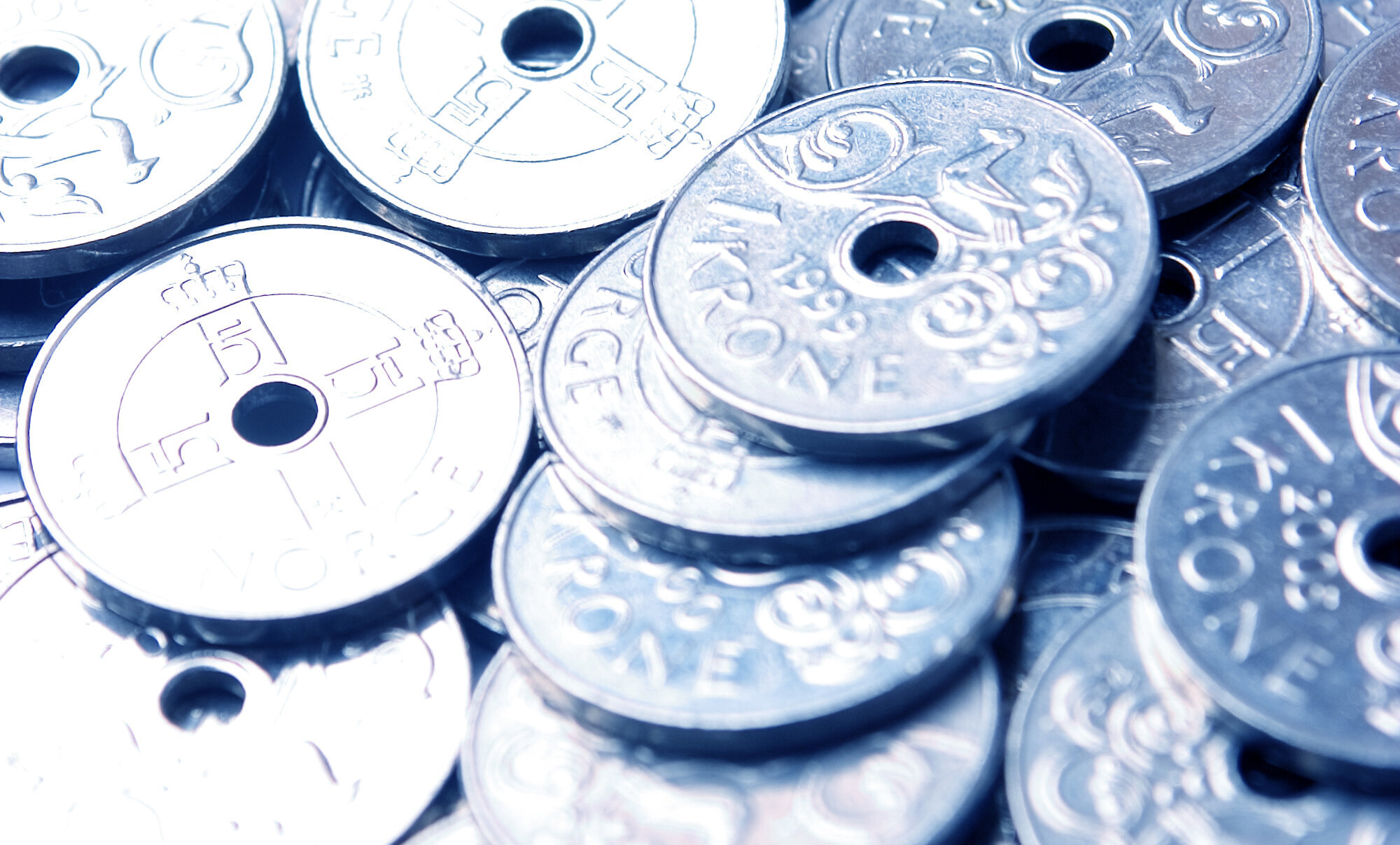 Bildet viser norske 1-kronemynter