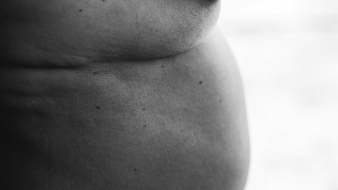 Utsnitt av kropp Utsnitt av en naken kropp