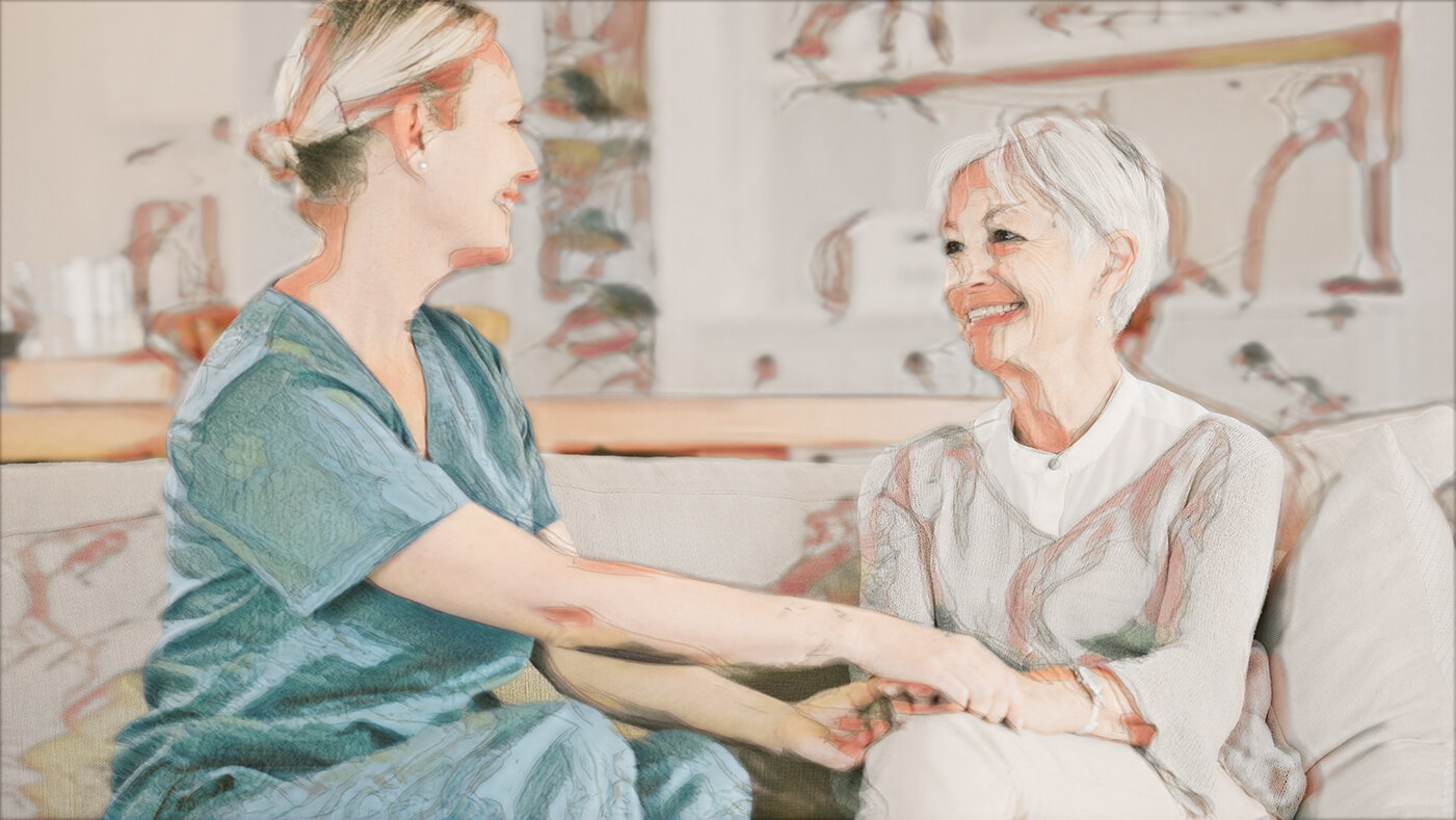 Sykepleier og en pasient som har en god relasjon Bildet viser en sykepleier og en pasient som har en god relasjon