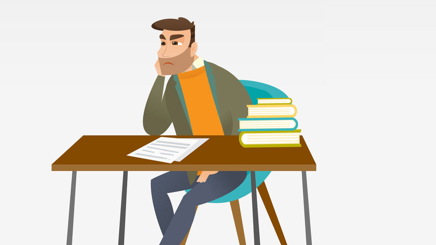 Misfornøyd mann Illustrasjonen viser en mann som sitter ved et skrivebord. På skrivebordet ligger en bunke bøker, og noen papirer ligger foran ham. Han ser misfornøyd ut