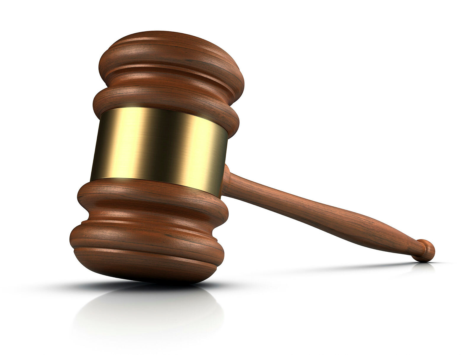 Dommerklubbe Bildet viser en dommerklubbe i mørkt treverk og gull.